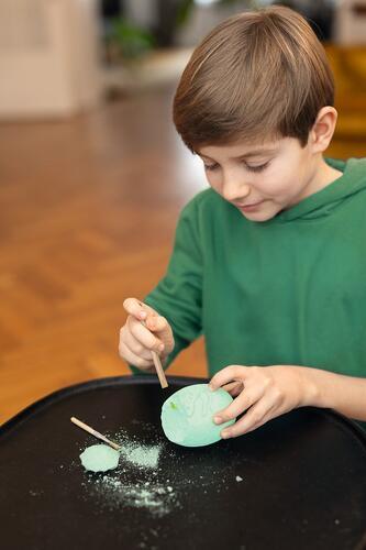 Glow-in-the-dark dinosaur skeleton dig kit