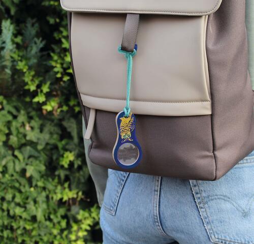 Pocket magnifier with cord